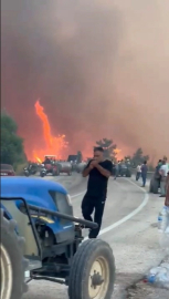 Alevler göğe ulaştı o aldırış etmeden sigarasını yaktı...