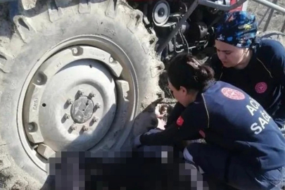 Kullandığı traktörün altında kalan yaşlı adam can verdi