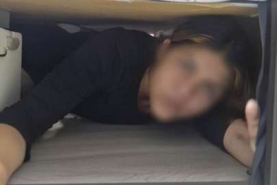 107 suç kaydı olan kadın hırsız, polis baskınında baza altında yakalandı