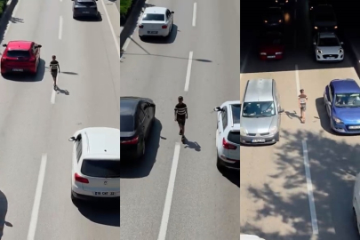 Canını hiçe sayarak akan trafikte böyle yürüdü